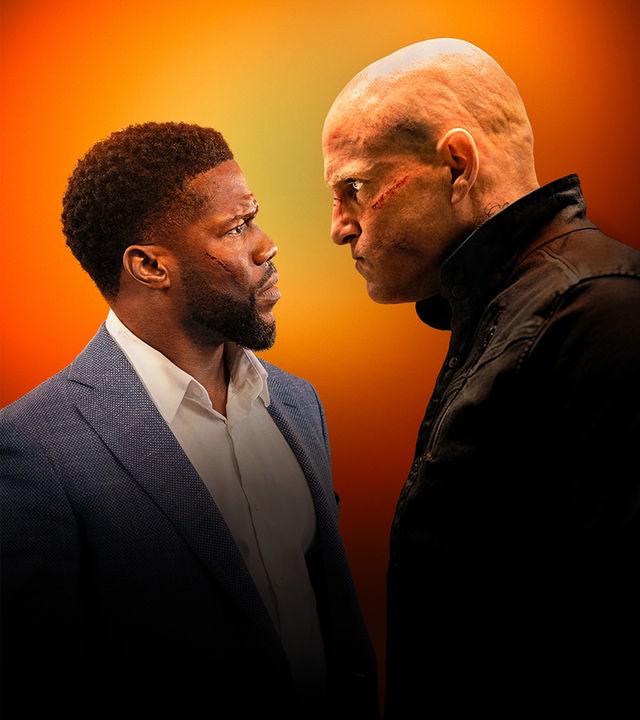 "The Man From Toronto": Teddy Jackson (Kevin Hart) und der Mann aus Toronto (Woody Harrelson) stehen sich gegenüber und schauen sich in die Augen.