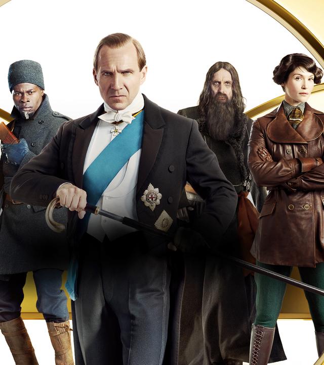 Conrad (Harris Dickinson) trägt einem grauen Anzug; Shola (Djimon Hounsou) trägt eine graue Jacke, eine graue Mütze eine graue Hose mit braunen Stiefeln; Lord Oxford (Ralph Fiennes) trägt einen festlichem Zweiteiler mit Orden und seinen Gehstock in der rechten Hand, den er vor sich hält; Rasputin (Rhys Ifans) trägt eine Mönchskutte und Polly (Gemma Arterton) eine braune Lederjacke, grüne Hosen und braune Stiefel.