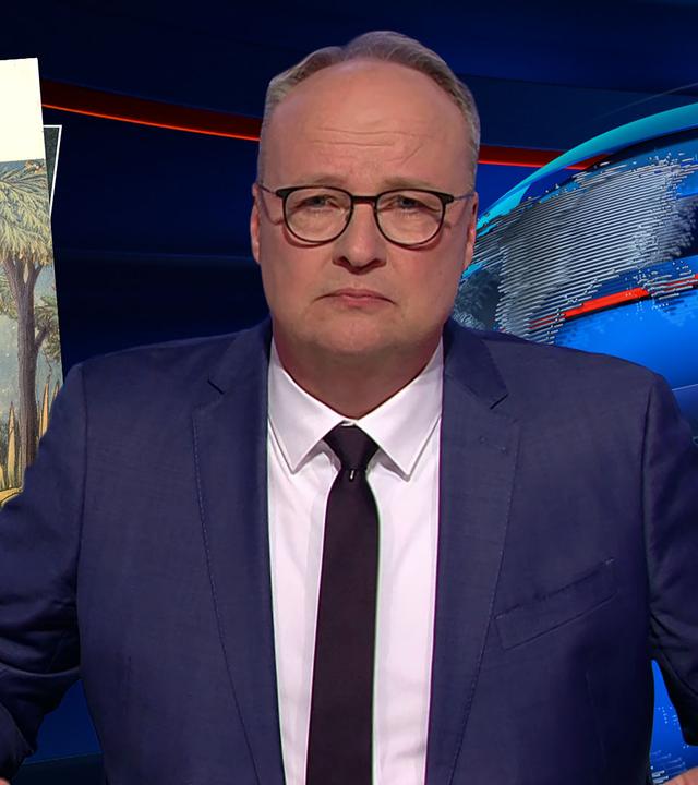 Oliver Welke sitzt am Schreibtisch. Links von ihm ist ein verfremdetes Buchcover mit dem Titel "Wo die faulen Kerle wohnen" zu sehen. Auf dem Cover liegt ein Monster mit einer Bierflasche unter einer Deutschlandflagge.