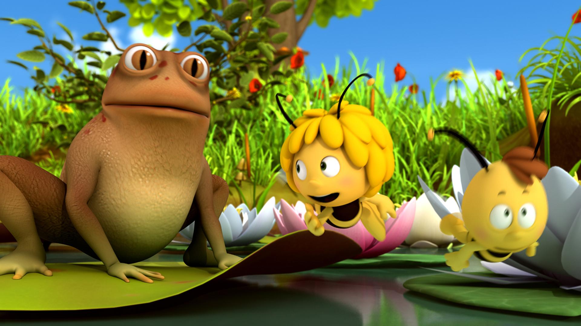 Maja und Willi fliehen vor dem großen Frosch, der auf einer Seerose sitzt.