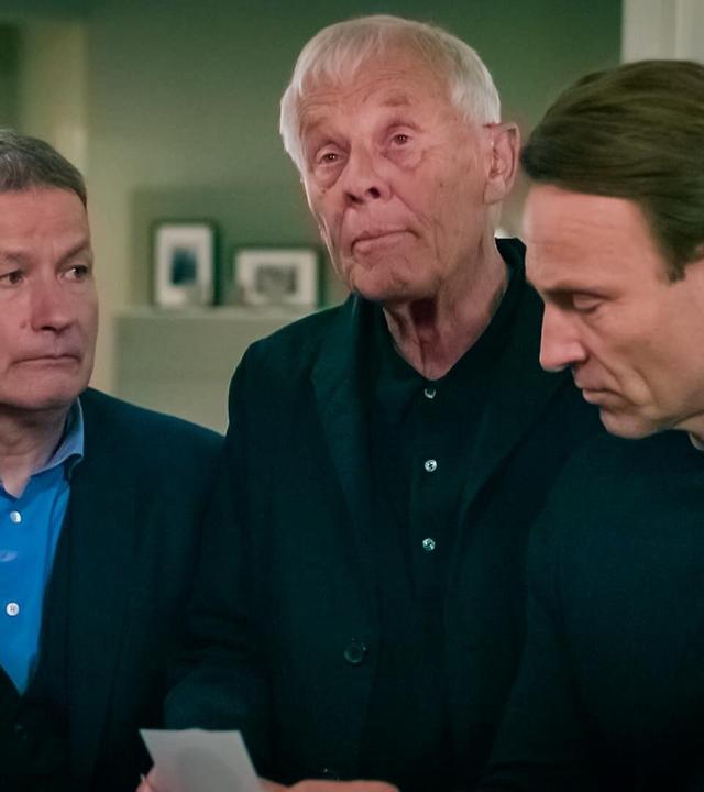 Drei Männer in Schwarz