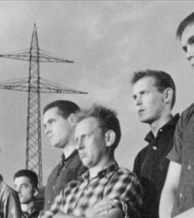 Männer auf der Großbaustelle - Zwischen Baggern und Baracken