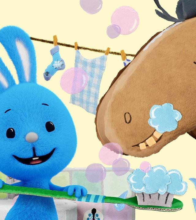 Kikaninchen putzt dem Pferd die Zähne