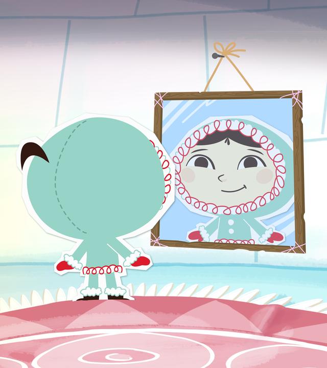 Inui schaut sich in ihrem Spiegel an und sieht glücklich aus. Sie ist in einem Iglu. 