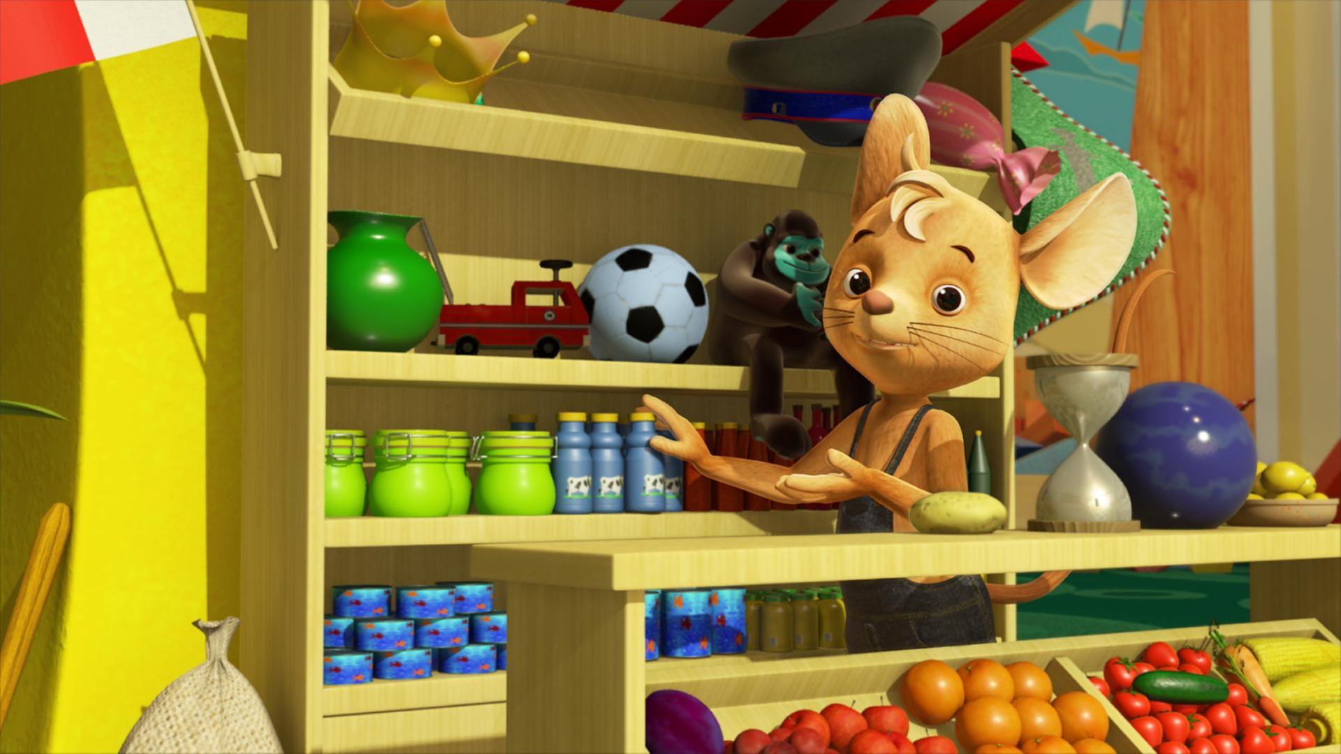 Jo steht in seinem Kaufladen vor einem Regal.