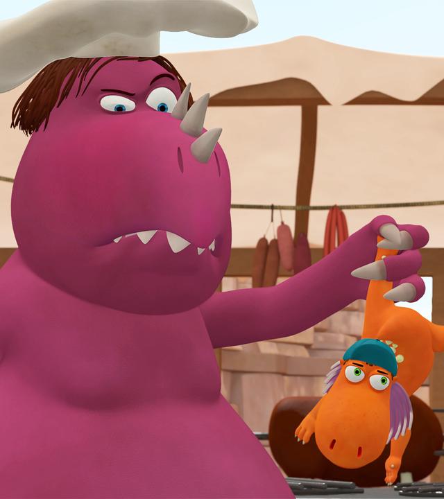 Chefkoch hält Kokosnuss an einem Bein über einen Kessel.