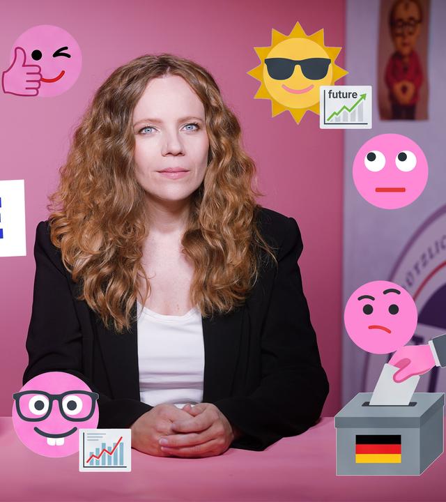 Sarah Bosetti sitzt an einem Tisch vor einem rosa Hintergrund. Um sie herum sind verschiedene Symbole und Emojis zu sehen. Links steht groß das Wort "KOMMENTARE".
