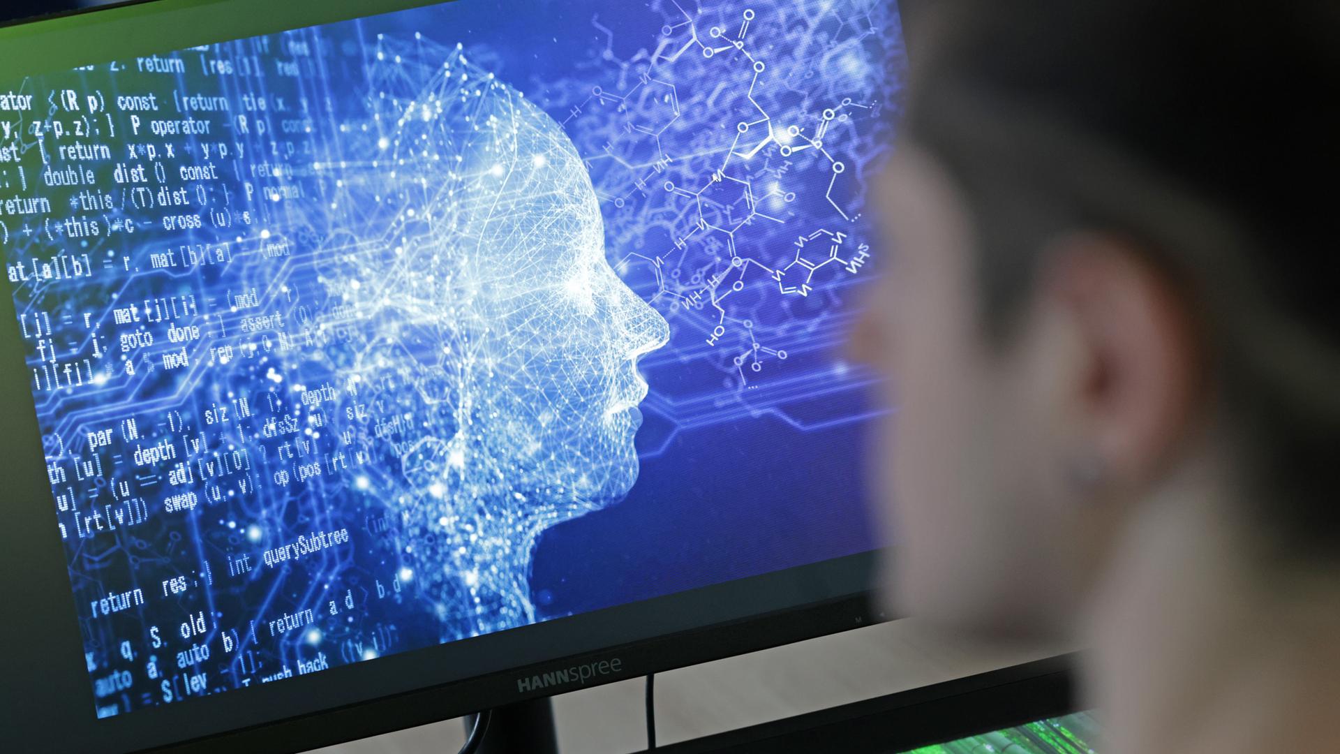 Symbolbild KI Künstliche Intelligenz: Student vor Bildschirm