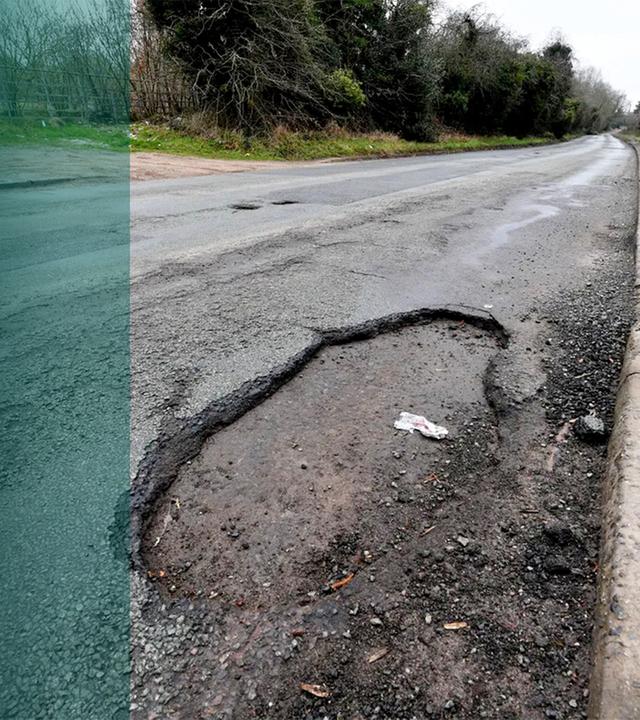 Kaputte Straße mit Schlaglöchern