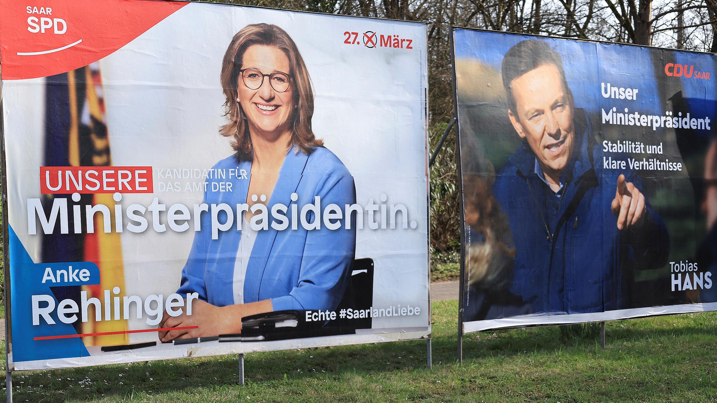 Wahlplakate von SPD (Anke Rehlinger) und CDU (Tobias Hans) im Saarland