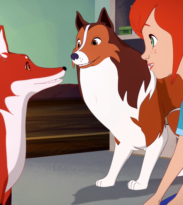 In einem Raum der Tierklinik hockt Zoé auf dem Boden. Die Füchsin sitzt vor ihr, Lassie steht neben ihr, Zoé und Lassie schauen die Füchsin an.