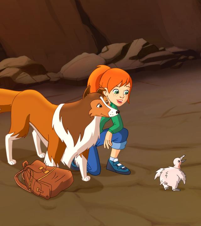 Lassie, Zoé und Harvey stehen rund um das Kondorjunge.