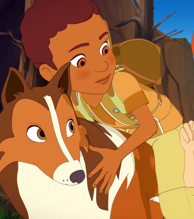 Zoé, Harvey und Lassie verstecken sich im Gebüsch. Harvey und Lassie schauen Zoé an, die den beiden mit einem Handzeichen signalisiert still zu sein.