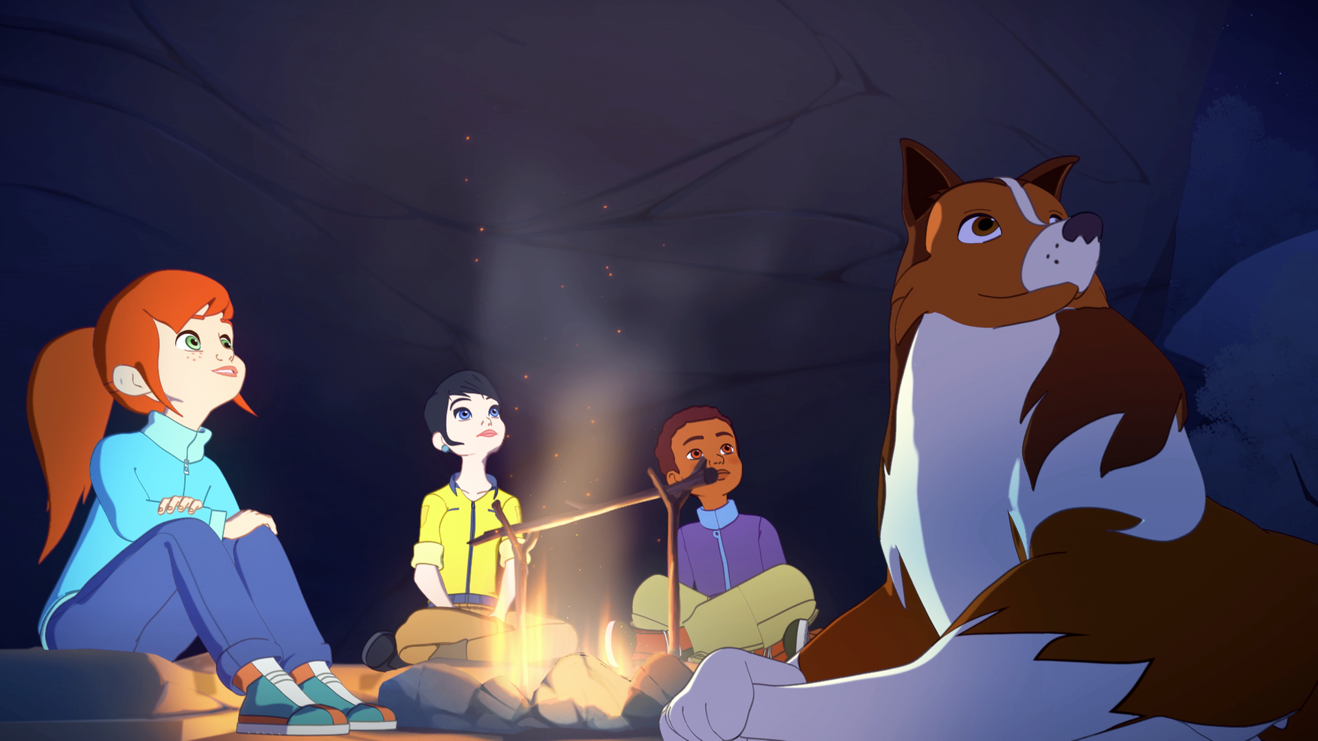 In der Nacht sitzen Zoé, Kim, Harvey und Lassie vor einer Felswand um ein Lagerfeuer herum und schauen nach oben.