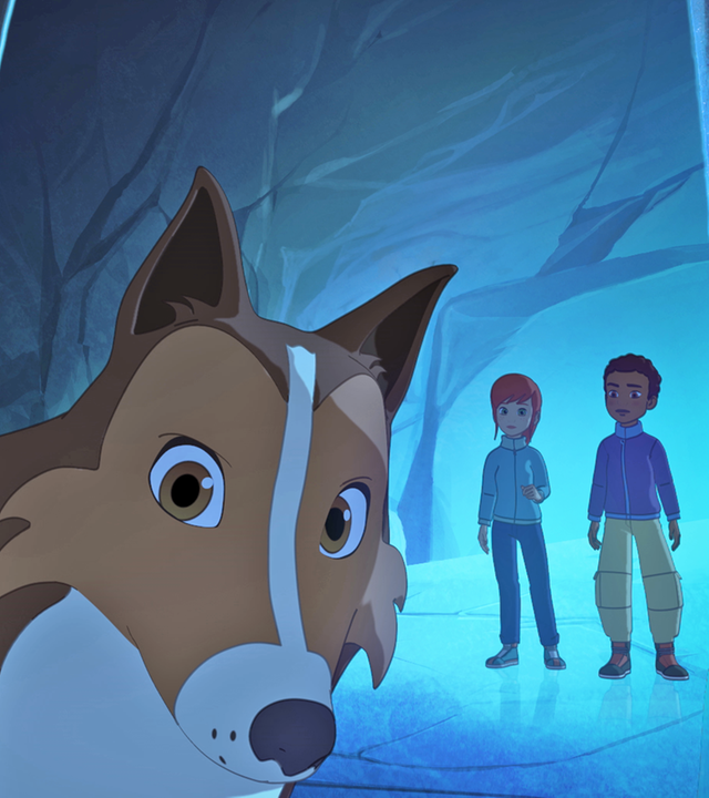 Lassie ist im Vordergrund zu sehen, während Harvey und Zoé weiter hinten stehen. Sie befinden sich in einer Eishöhle.