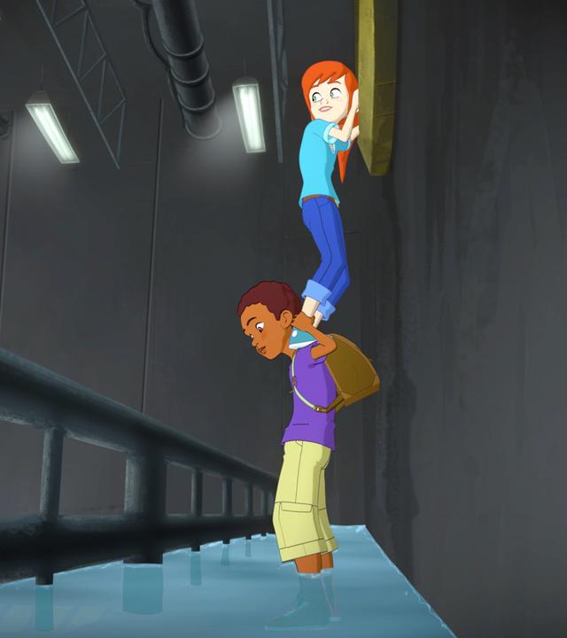 Harvey hat Zoé auf den Schultern, sie versucht, an etwas dranzukommen. Die Beiden stehen in einem unterirdischen Gang.