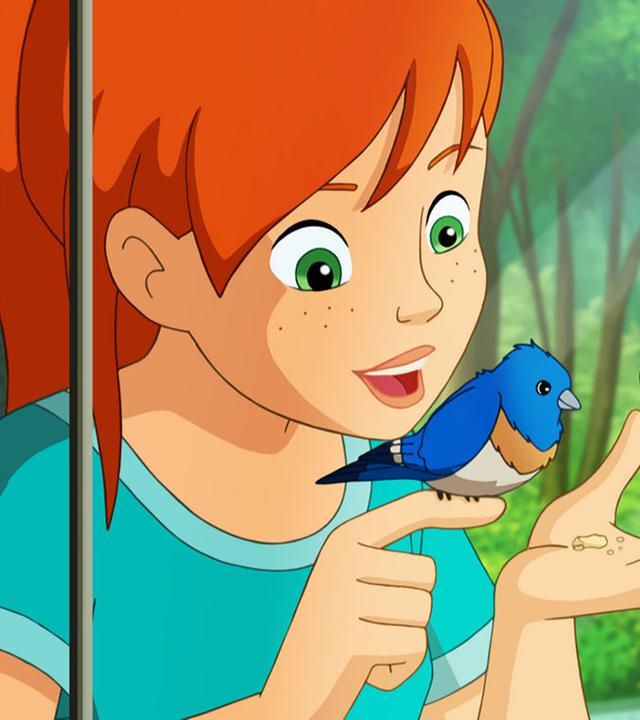 Auf Zoés Finger sitzt ein kleiner Vogel und schaut auf die Krümmel in ihrer anderen Hand. Zoé und Lassie schauen ihn an.