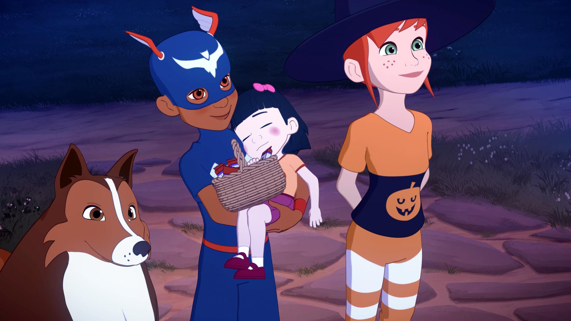 Lassie, Zoé und Harvey sind in Halloweenkostümen verkleidet. Harvey trägt ein kleines Mädchen im Arm, das schläft.