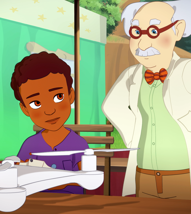 Hinter ihrem Stand, der im Freien aufgebaut ist, stehen Harvey und Doc Dudley und betrachten eine vor ihnen liegende Drohne.