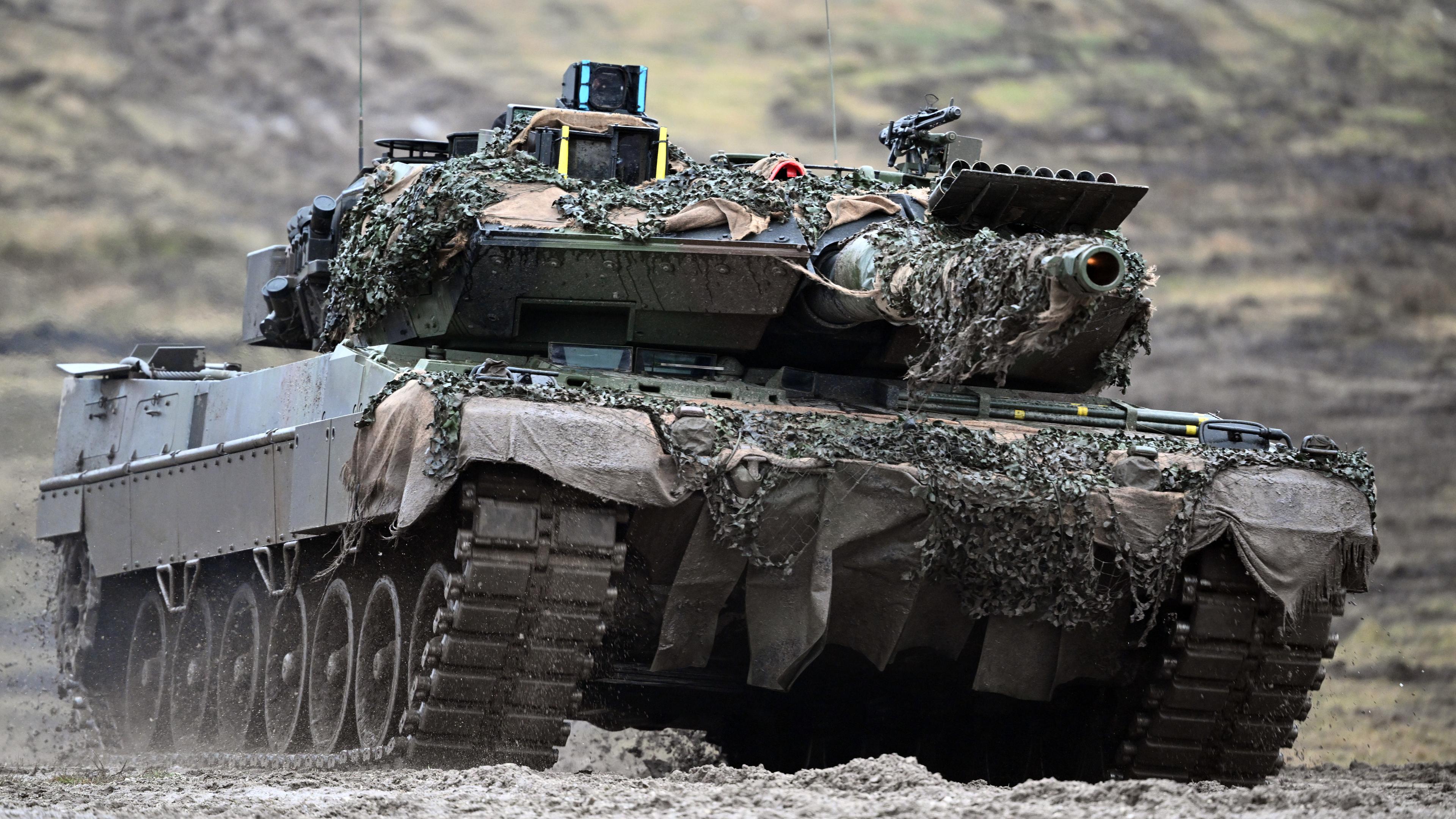 A Leopard 2A6 from the 203rd tank battalion of the Bundeswehr passes over the Senne military training ground.