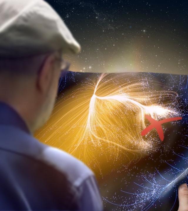 Harald Lesch blickt auf eine Karte des Universums