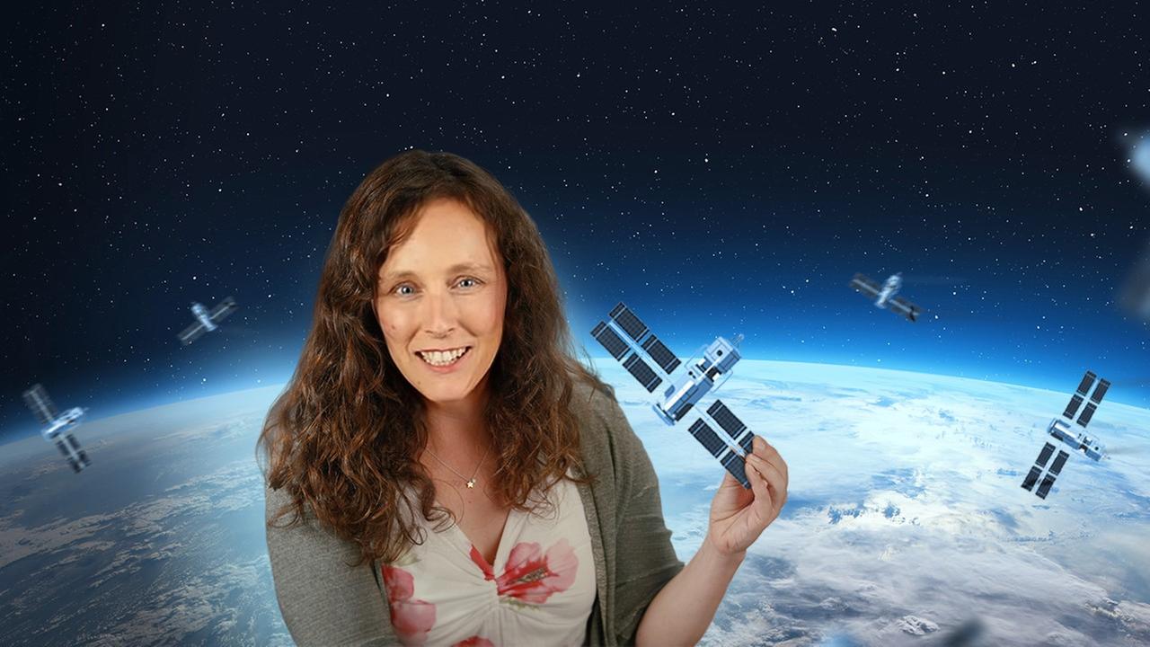Grafik: Suzanna Randall hält Satelliten in der Hand