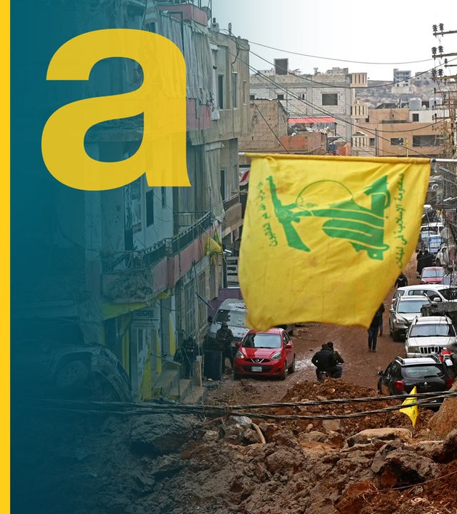 Wehende Hisbollah-Flagge vor den Trümmern im Libanon