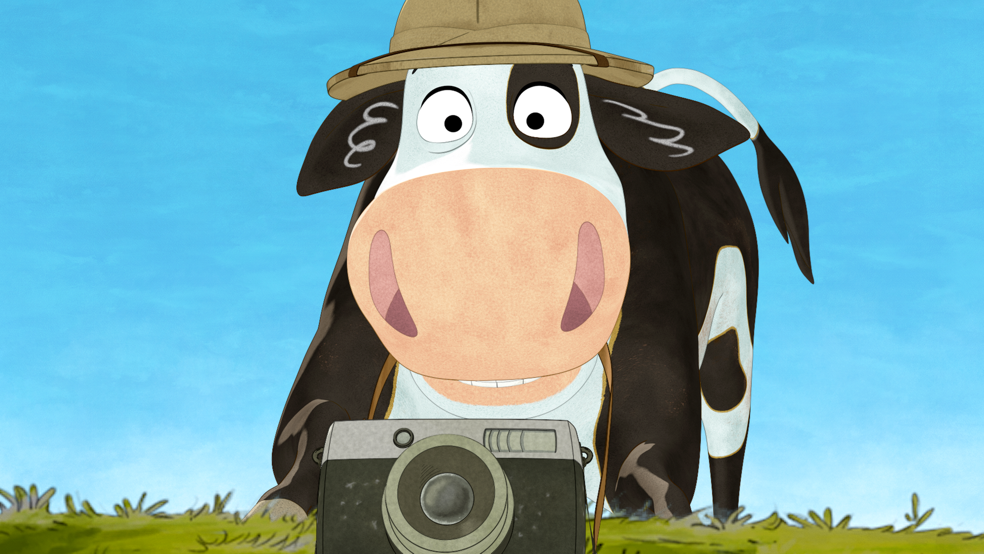 Lieselotte hat einen Safarihut auf und eine Kamera vor sich.