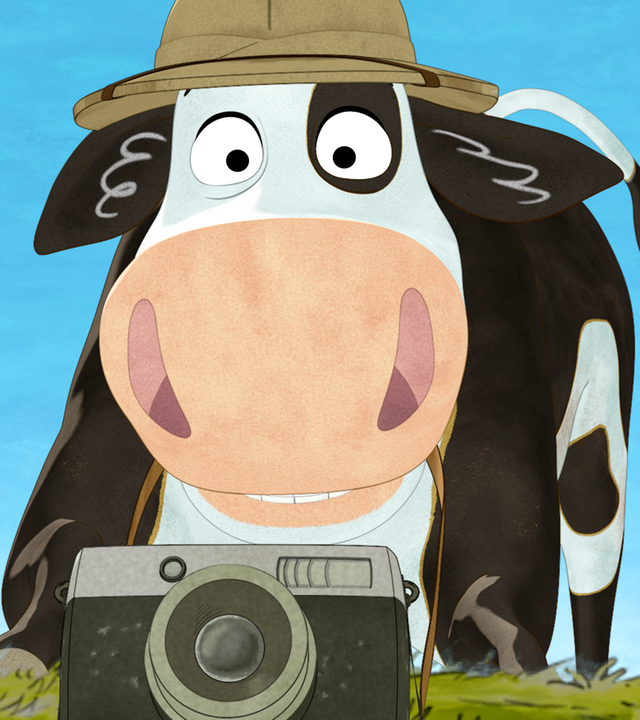 Lieselotte hat einen Safarihut auf und eine Kamera vor sich.