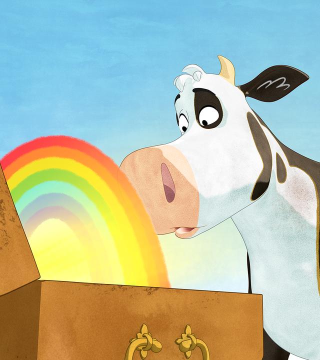 Lieselotte steht staunend vor einer Schatztruhe, aus der ein bunter Regenbogen scheint.