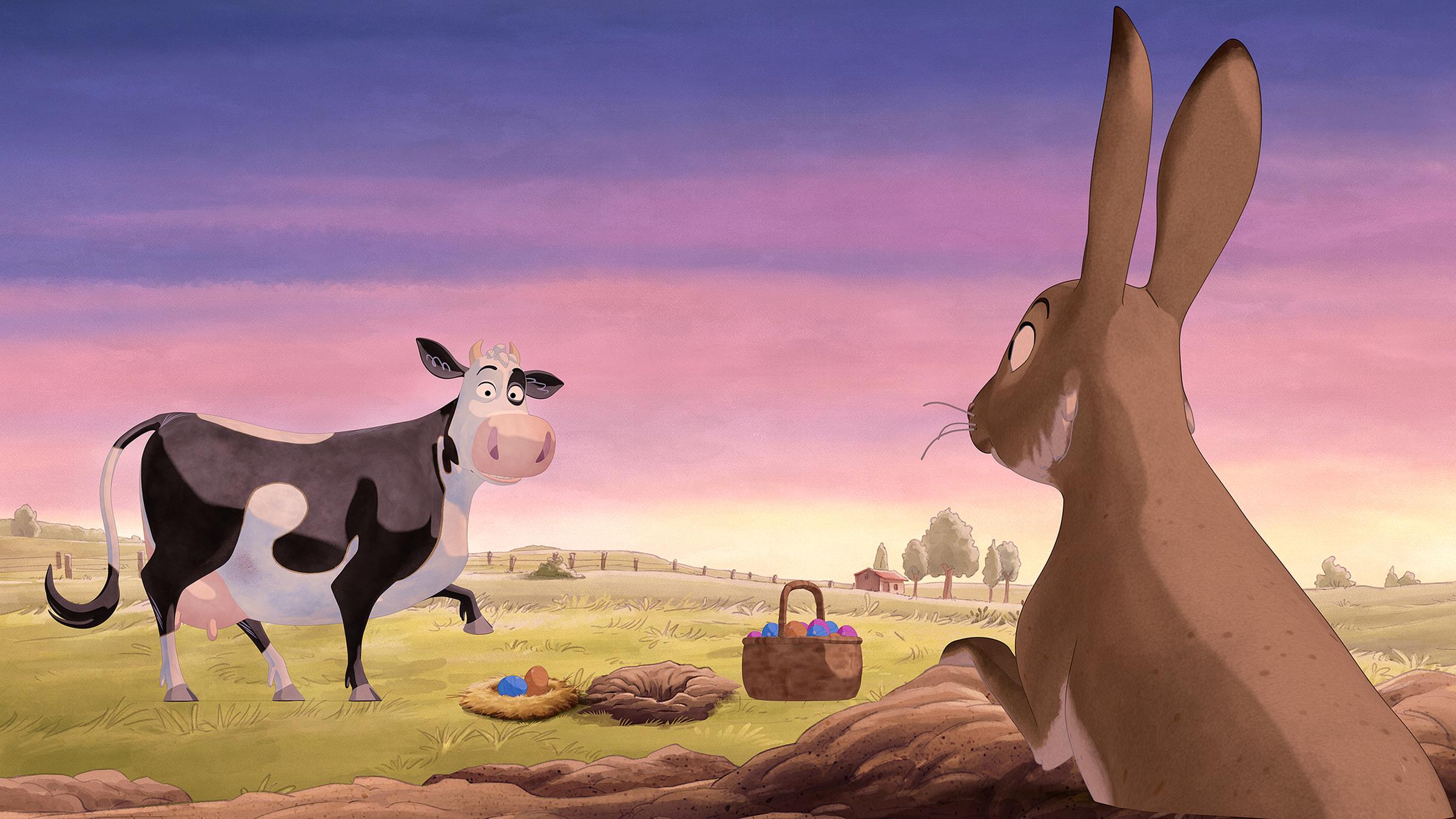 Lieselotte und der Hase gucken sich an. Zwischen ihnen steht ein Korb mit bunten Eiern.