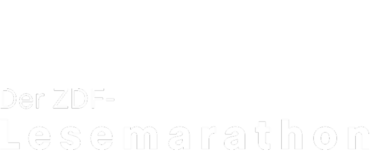 Ein Sessel, ein Beistelltisch und eine Leselampe auf einer sonst dunklen Bühne