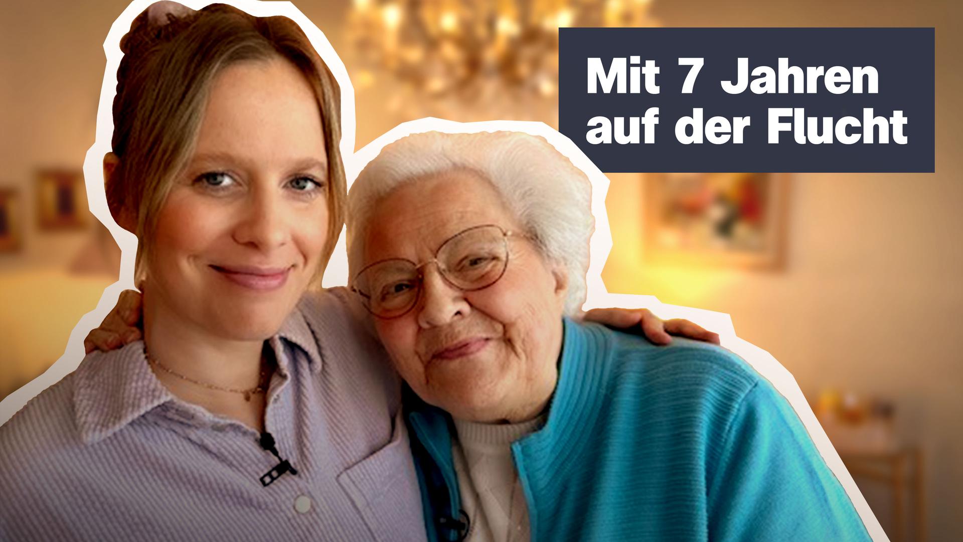 Eine junge, blonde Frau und eine ätltere, weißhaarige Frau liegen sich in den Armen.