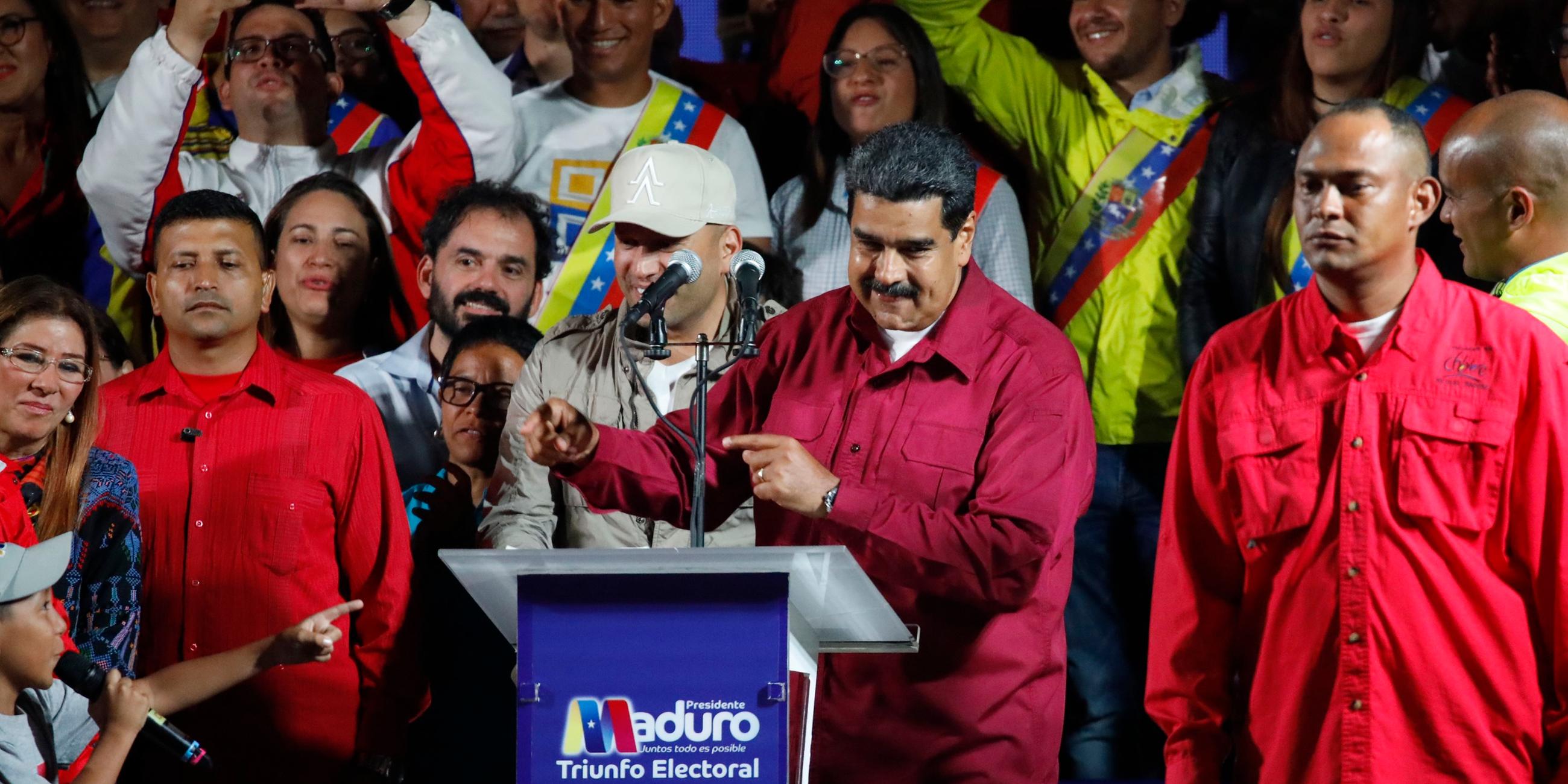 venezuela's president maduro stands with supporters after the results of the election were released in caracas