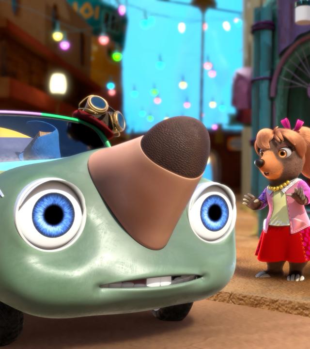 Dotty sitzt in einem Auto mit zwei großen Augen als Scheinwerfer und einer Nase auf der Motorhaube. Es ist der zum Auto verzauberte Maulwurf Moley. Mona Lisa und Mischmasch stehen mit erstaunten Mienen vor dem Auto.