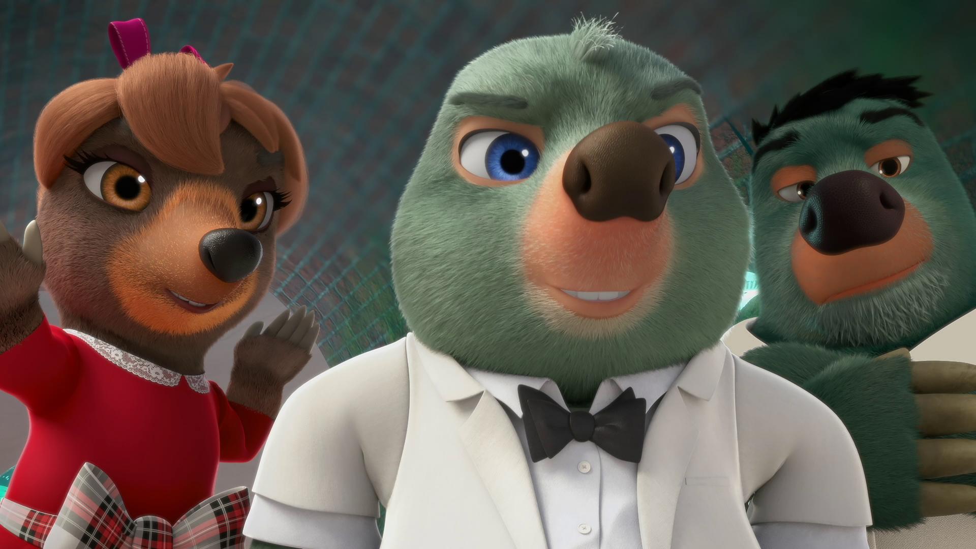 Moley trägt ein weißes Hemd, Sakko und eine schwarze Fliege, ganz so wie James Bond. Er blickt mit selbstbewusster, cooler Miene in die Kamera.