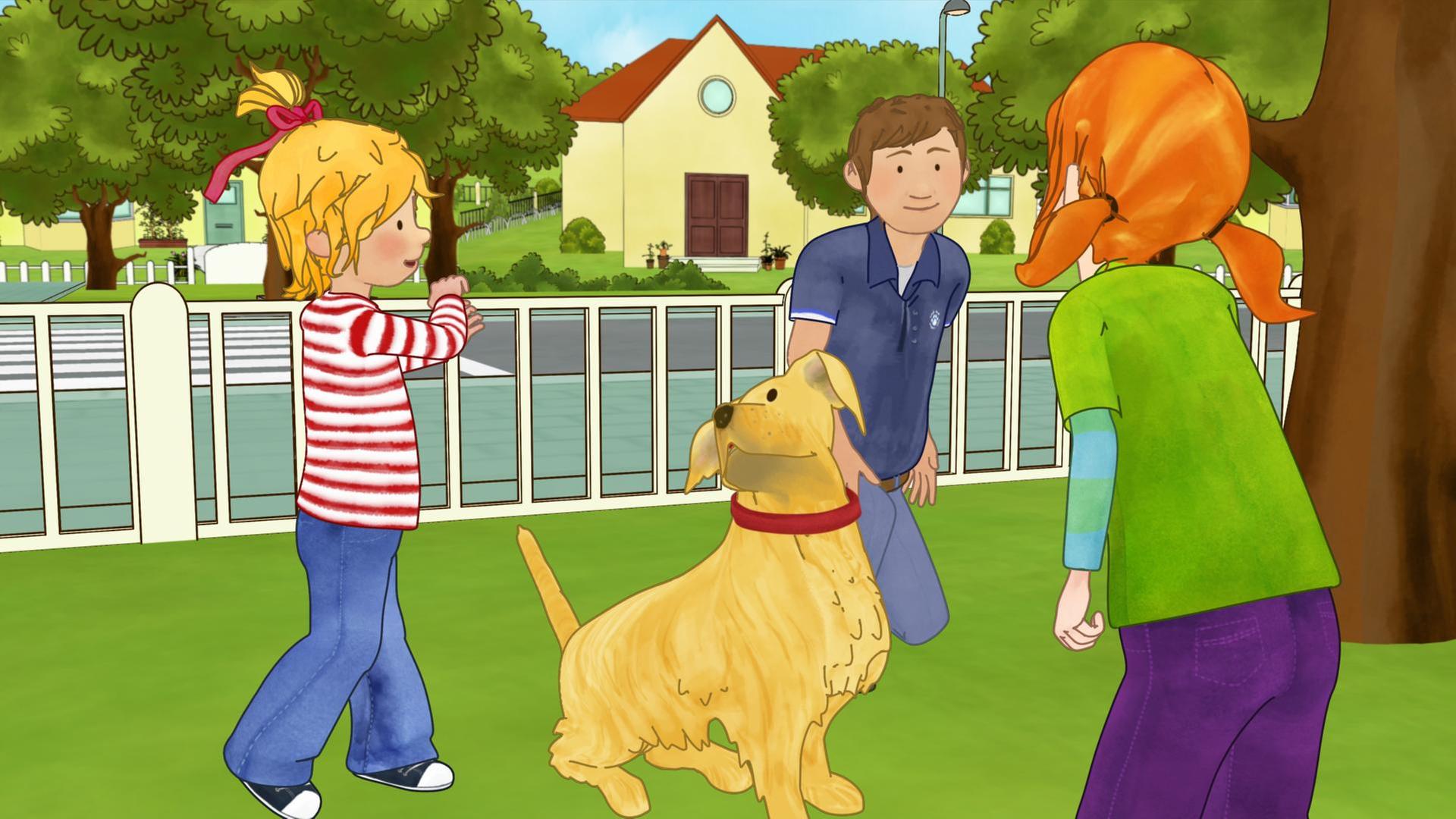 Conni ist im Park und lernt den Umgang mit Hunden.