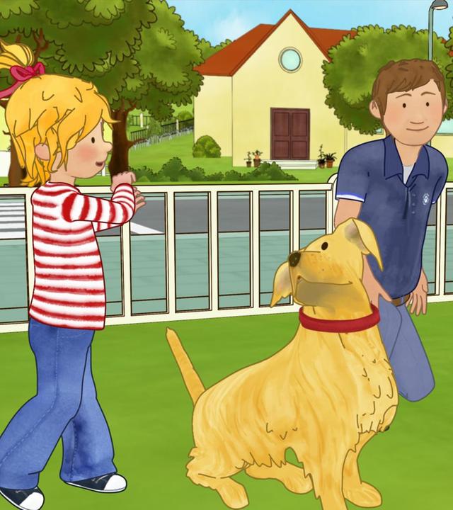 Conni ist im Park und lernt den Umgang mit Hunden.