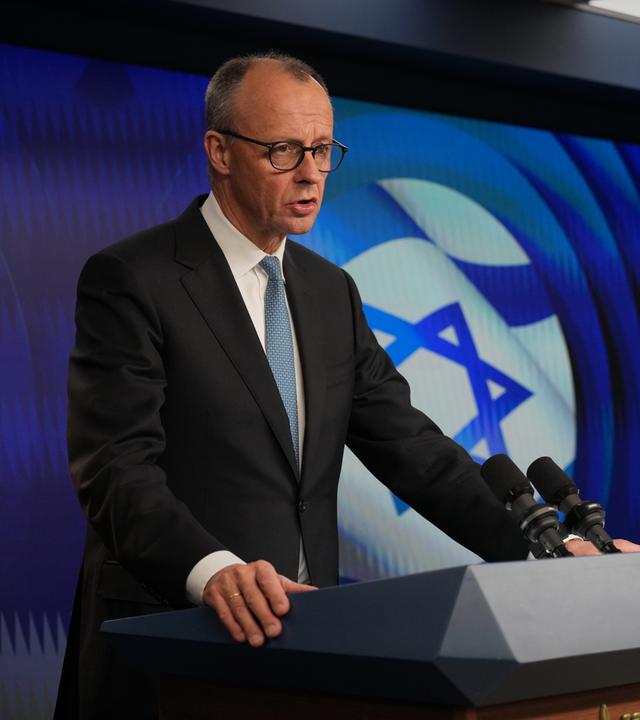 Israeli Prime Minister Benjamin Netanyahu (R) and German Chancellor Friedrich Merz speak to the media during a joint press conference in Jerusalem