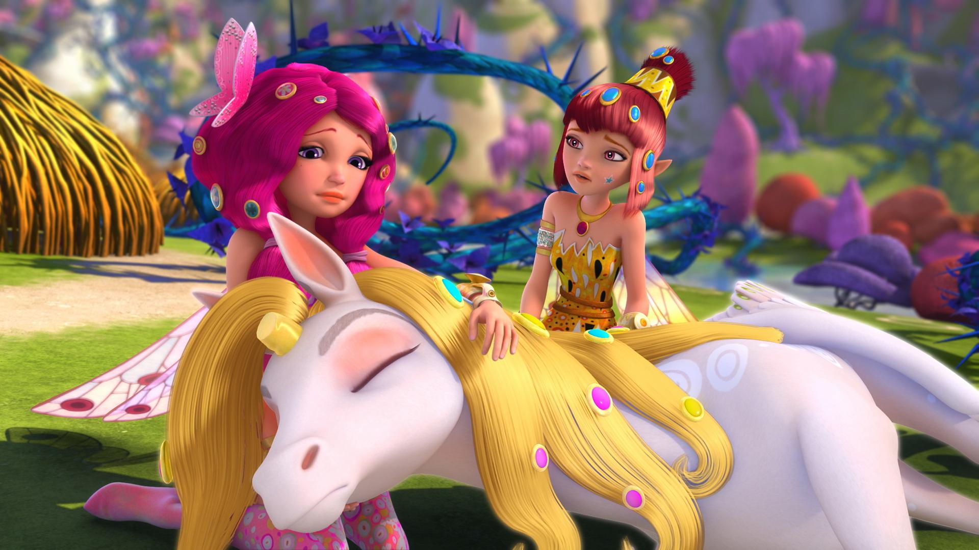 Mia und Yuko beugen sich über den gesenkten Kopf von Onchao, dem sein goldenes Horn geraubt wurde.
