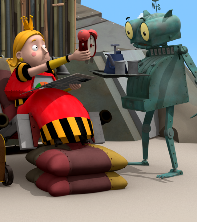 Rösti muss den Prinzessin Magnesias Diener spielen. Magnesia sitzt auf einer Liege und greift nach einem Wecker, den ihr Rösti auf einem Tablett hinhält.