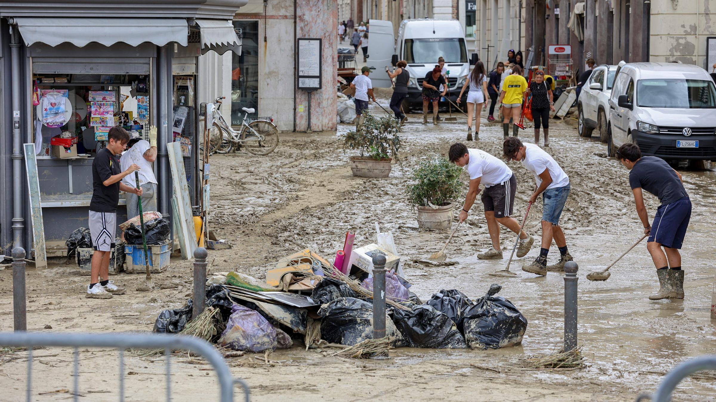 Following the flooding in central Italy, the first clean-up efforts began on the streets of Senigallia.