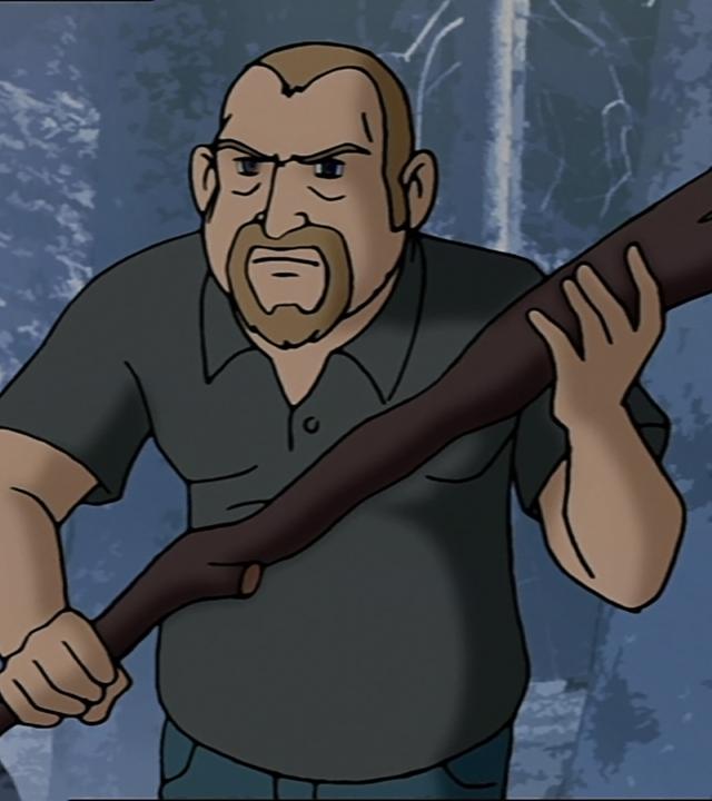 Hasso Flühter trägt einen großen Ast in seinen Händen und läuft mit grimmiger Miene durch den Wald. 
