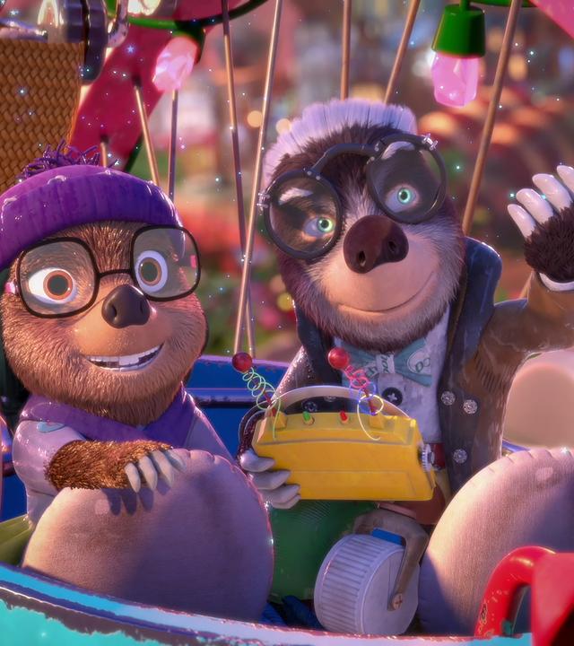 Dotty und ihr Onkel Mischmasch sitzen gut gelaunt in einer Gondel des Riesenrades und genießen die Fahrt.