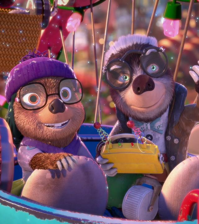 Dotty und ihr Onkel Mischmasch sitzen gut gelaunt in einer Gondel des Riesenrades und genießen die Fahrt.