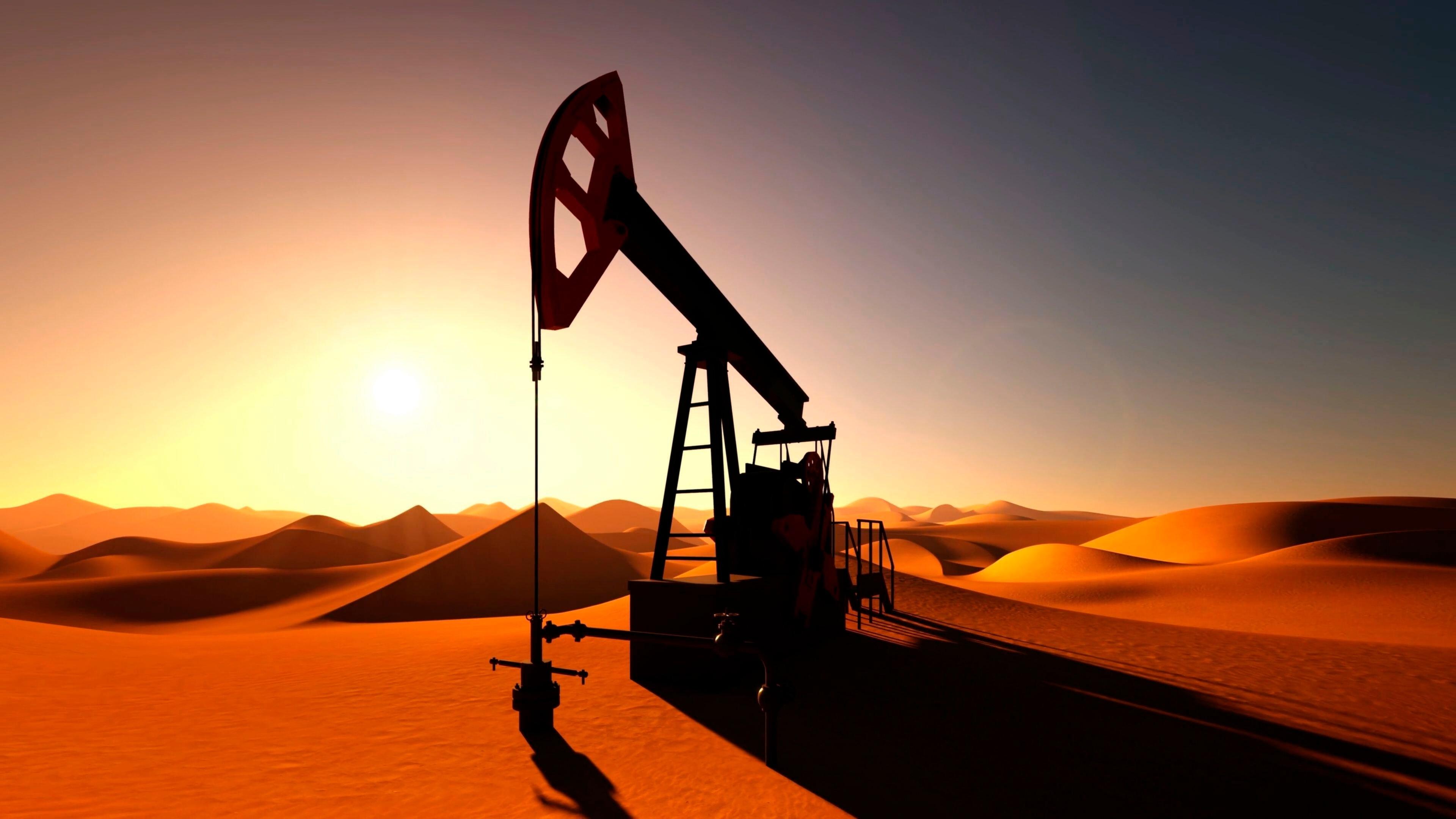 Ölpumpe in der Wüste bei Sonnenuntergang.