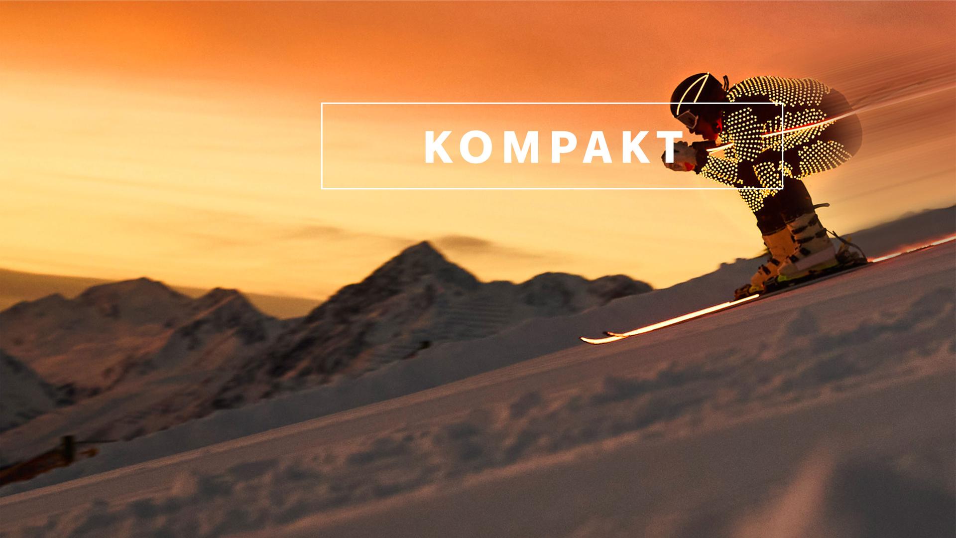 Das Wintersport "KOMPAKT"- Logo vor Bergkulisse mit einem Alpin-Skifahrer