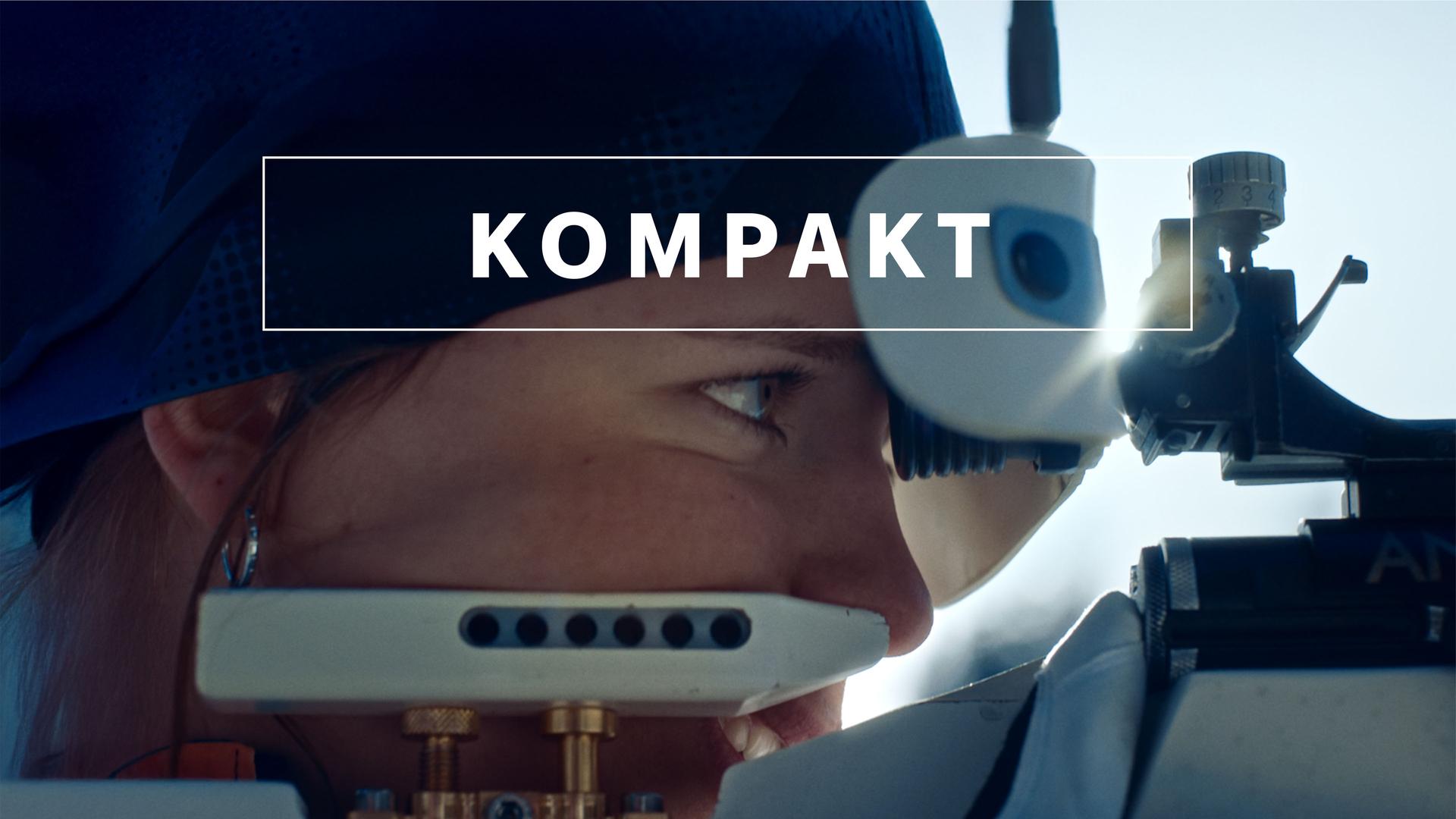 Das Wintersport "KOMPAKT"- Logo vor Biathlon-Athletin am Schießstand