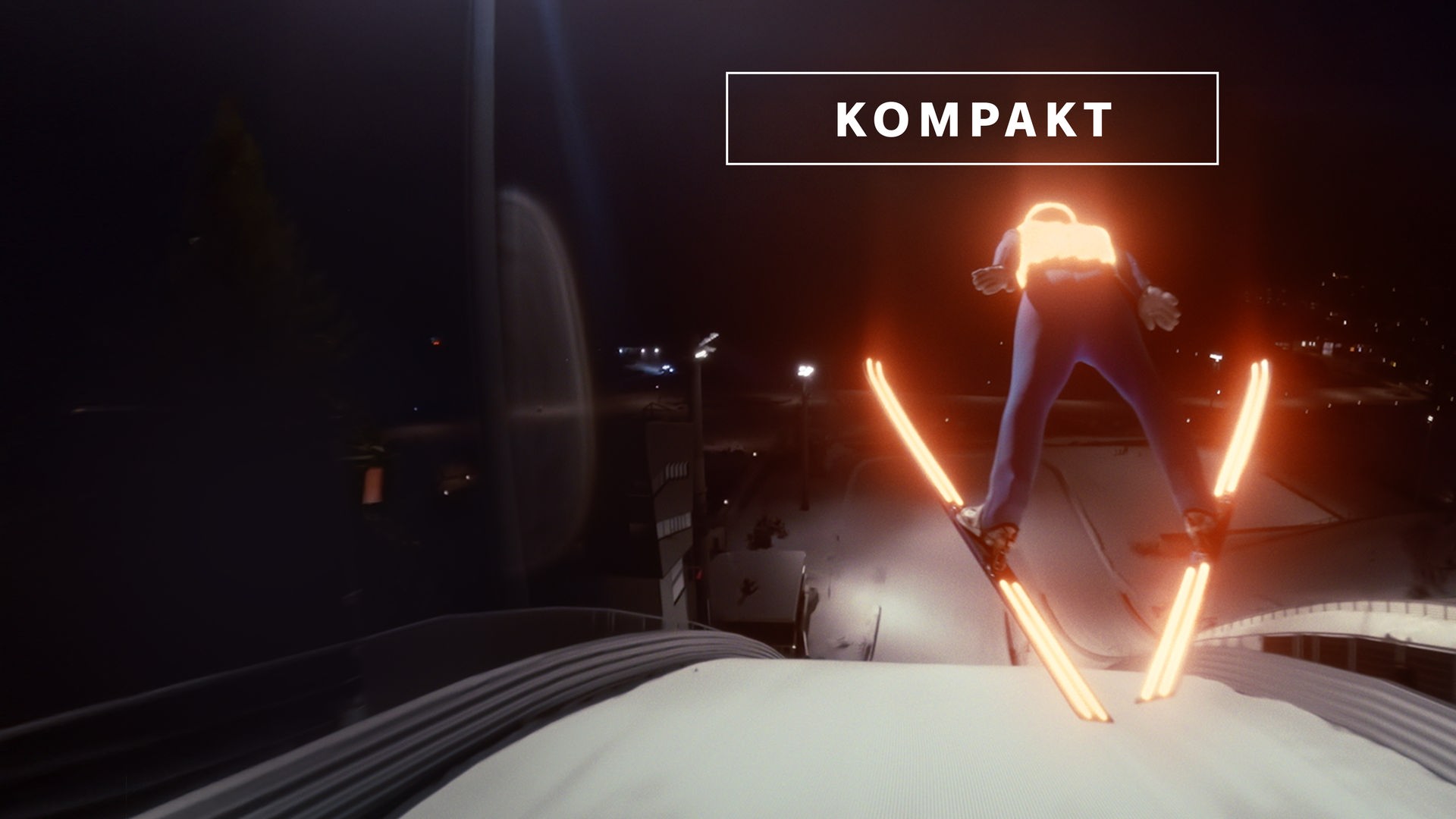 Das Wintersport "KOMPAKT"- Logo vor Skispringer springt von der Schanze