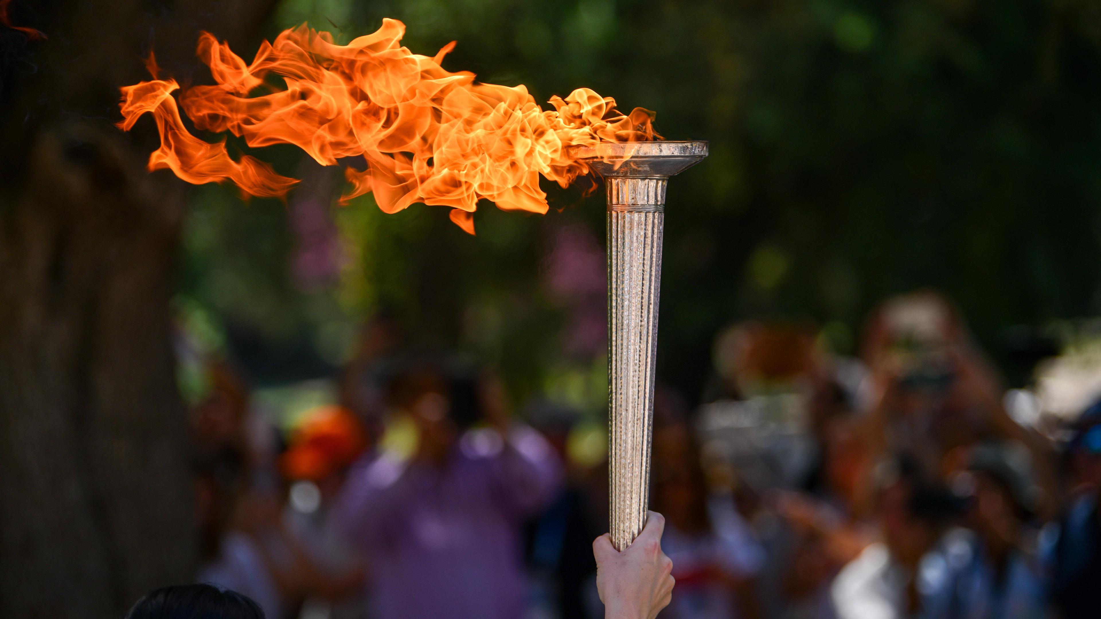 The Olympic Flame is carried by the first torchbearer Greek Rowing Olympic Champion Stefanos Ntouskos not visible during the rehearsal performance of lighting the Olympic Flame ceremony